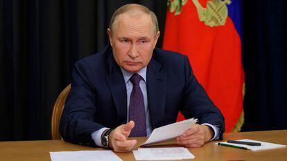 Russian President Vladimir Putin gestures as he attends a meeting on agricultural issues via videoconference in the Bocharov Ruchei residence in the Black Sea resort of Sochi, Russia, Tuesday, Sept. 27, 2022. (Gavriil Grigorov, Sputnik, Kremlin Pool Photo via AP)