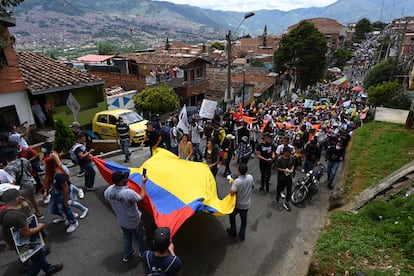 People take part in a new protest against the government of Colombian President Ivan Duque, in Medellin, Colombia, on May 12, 2021. (Photo by Joaquin SARMIENTO / AFP)