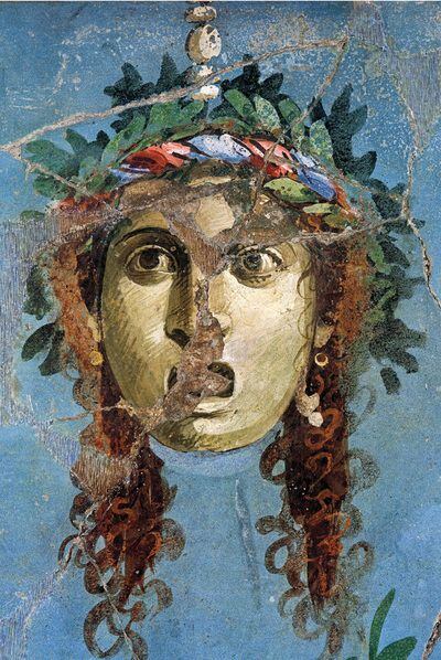 Máscara teatral pintada en un fresco de la Casa del Brazalete de Oro (primera mitad del siglo I), del libro <i>El arte de Pompeya.</i>