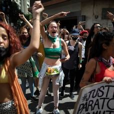 Women shout in front of the Ministry of Interior and Justice on the International Day for Elimination of Violence against Women in Caracas,Venezuela, Wednesday, Nov, 25 2020. (AP Photo/Ariana Cubillos)