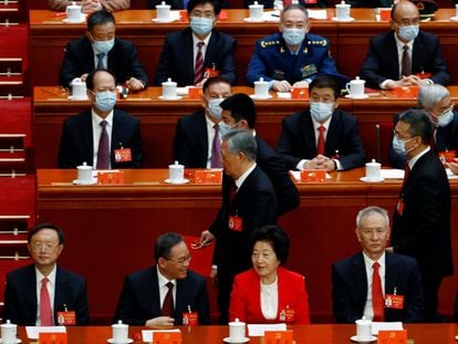 Former Chinese president Hu Jintao leaves his seat during the closing ceremony of the 20th National Congress of the Communist Party of China, at the Great Hall of the People in Beijing, China October 22, 2022. REUTERS/Tingshu Wang