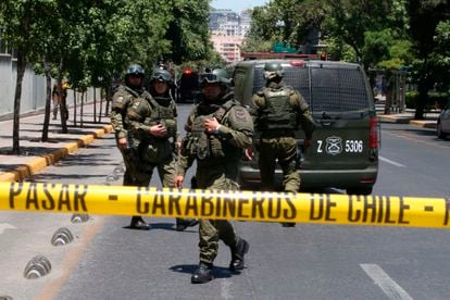 Members of the Carabineros line a street in Santiago after a criminal action in January 2019.