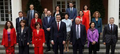 Spain&#039;s new government members pose for a photo following their first cabinet meeting at the Moncloa Palace in Madrid