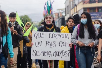 A woman holds a sign during a protest in Nariño, Colombia, on June 28, 2021.