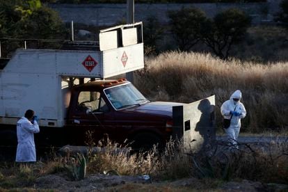 Police inspect an abandoned truck that was modified into a ram, found on the outskirts of Tula after a gang rammed several vehicles into a prison and escaped with nine inmates, in Tula, Mexico, Wednesday, Dec. 1, 2021. (AP Photo/Ginnette Riquelme)