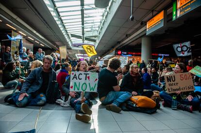 A group of activists from Greenpeace and Extinction Rebellion occupy the main lounge of the Schiphol airport in Amsterdam, the Netherlands, on November 5.