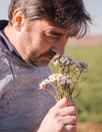 Smelling some aromatic herbs.