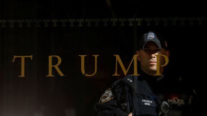 A police officer stands guard inside Trump Tower in Manhattan in March 2023.