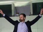 Santiago Abascal, leader of far-right Vox Party, gestures to supporters outside the party headquarters after the announcement of the general election first results, in Madrid, Spain, Sunday, Nov. 10, 2019. Spain's Interior Ministry says that early results show Socialists winning Spain's national election, but without a clear end to the country's political deadlock. Vox is also surging to become the country's third political force, more than doubling its presence in the parliament's lower house from 24 to 53 deputies only six months after its debut. (AP Photo/Andrea Comas)