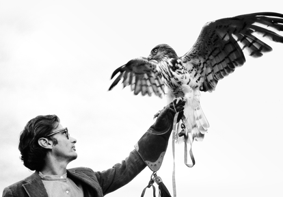 Avedon with an eagle in Ireland in 1969.