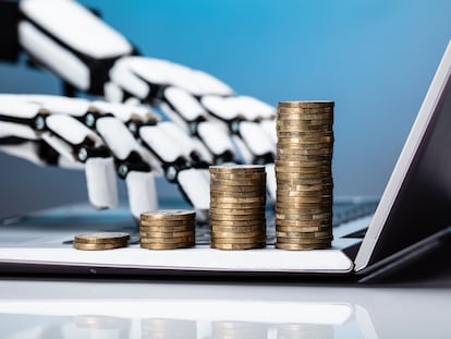 Robotic Hand Working On Laptop