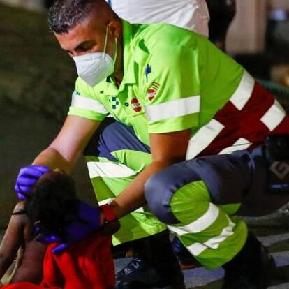 SENSITIVE MATERIAL. THIS IMAGE MAY OFFEND OR DISTURB A baby is reanimated after being disembarked from a Spanish coast guard vessel, in the port of Arguineguin, in the south part of the island of Gran Canaria, Spain March 16, 2021. REUTERS/Borja Suarez