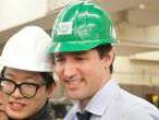 Canada's Prime Minister Justin Trudeau takes selfies with students at the George Brown College Casa Loma campus in Toronto.
