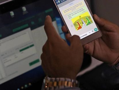Rohitash Repswal checks a WhatsApp message that he sent using a software tool that appears to automate the process of sending messages to WhatsApp users, inside his office in New Delhi