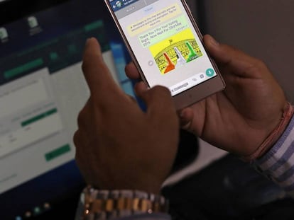 Rohitash Repswal checks a WhatsApp message that he sent using a software tool that appears to automate the process of sending messages to WhatsApp users, inside his office in New Delhi