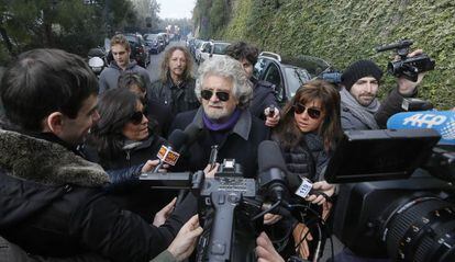 Five Stars movement&#039;s leader and former comedian Beppe Grillo arrives to vote at a polling station in Saint Ilario near Genova on February 25, 2013.Polls reopened in Italy on Monday for a second and final day of voting in a critical election for the future of the eurozone in which the centre-left Democratic Party is expected to win but fall short of a governing majority. AFP PHOTO / FABIO MUZZI