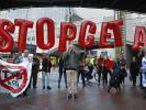 Demonstrators protest against CETA outside the EU summit in Brussels