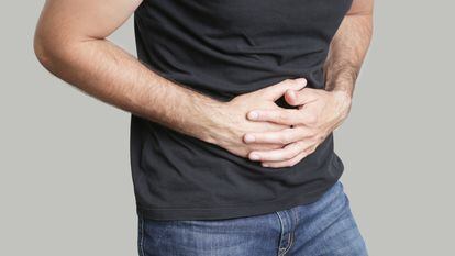Man having painful stomach ache, chronic gastritis or abdomen bloating