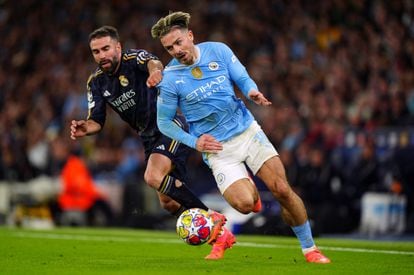 Jack Grealish of Manchester City escapes with the ball against Dani Carvajal of Real Madrid.
