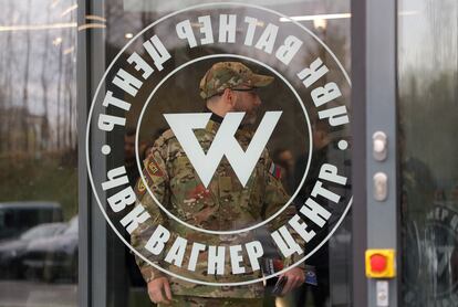 A man in camouflage clothing walks out of the Wagner group center in St. Petersburg on November 4. 