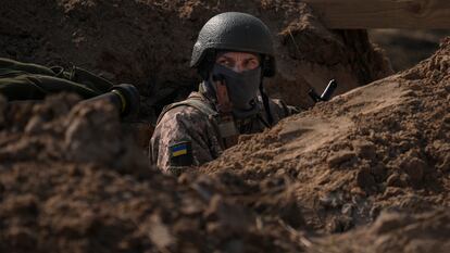 A Ukrainian serviceman stands in a trench at a position north of the capital Kyiv, Ukraine, Tuesday, March 29, 2022. The first face-to-face talks in two weeks between Russia and Ukraine began Tuesday in Turkey, raising flickering hopes there could be progress toward ending a war that has ground into a bloody campaign of attrition. (AP Photo/Vadim Ghirda)