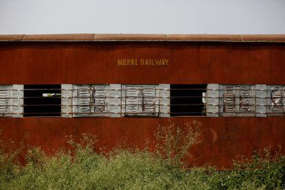 Plants grow along the abandoned coach of a train at the workshop of Nepal Railways Corporation Ltd., in Janakpur, Nepal, June 4, 2017. REUTERS/Navesh Chitrakar  SEARCH "CHITRAKAR RAILWAY" FOR THIS STORY. SEARCH "WIDER IMAGE" FOR ALL STORIES.