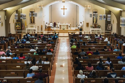 Mourners attend a vigil at Sacred Heart Catholic Church for the victims of the mass shooting at Robb Elementary School.