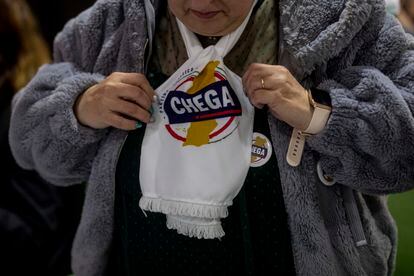 A Chega activist with a party scarf at a rally in Lamego, March 1.