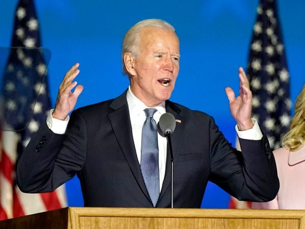 Democratic presidential candidate former Vice President Joe Biden speaks to supporters Wednesday, Nov. 4, 2020, in Wilmington, Del., as he stands next to his wife Jill Biden. (AP Photo/Andrew Harnik)