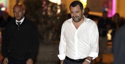 Interior Minister and Vice Premier Matteo Salvini, flanked by a body guard at left, arrives on foot to attend a cabinet meeting, in Rome, Tuesday, Nov. 13, 2018. Hours before the Italian populist government faced a deadline to submit a revised budget draft to the EU, the IMF said in a report that &quot;Italy needs to put to rest any concern about public debt sustainability, which recently has resurfaced.&quot; (AP Photo/Andrew Medichini)