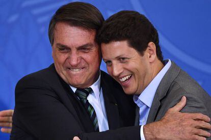 President Bolsonaro embraces Salles in February during an event aimed at attracting private investment to preserve the Amazon.