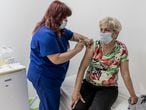 ALBENA, BULGARIA - MAY 20: A medical worker injects a COVID-19 vaccine to an employee of the Bulgarian Black Sea resort of Albena on May 20, 2021 in Albena, Bulgaria. Bulgaria prepares for a summer rebound from the Covid-19 pandemic's effects on the economy and tourism sector in particular. (Photo by Hristo Rusev/Getty Images)