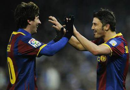 Messi y Villa celebran un tanto ante el Espanyol.