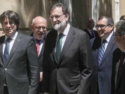 Carles Puigdemont y Mariano Rajoy, líderes de la exCDC y del PP, respectivamente.