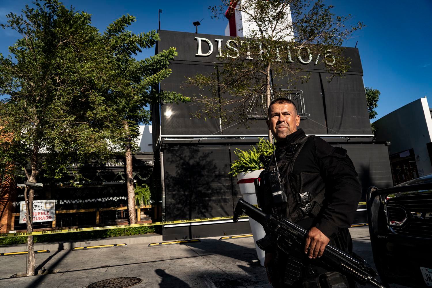 Elements of the Jalisco state police guard the District 5 Bar.