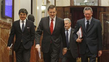 Jorge Moragas, Mariano Rajoy y Alberto Ruiz Gallard&oacute;n.