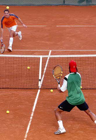 Robredo y Nadal, en un entrenamiento.