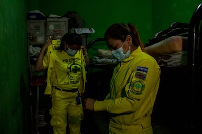 The yellow uniform with a green cross is recognized by Salvadoran society as a symbol of neutrality and humanitarianism.