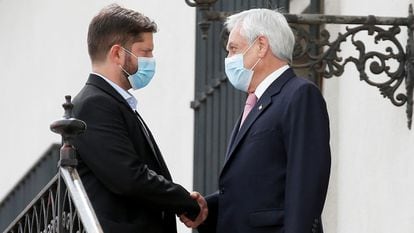 The president-elect of Chile, Gabriel Boric, greets the outgoing, Sebastián Piñera, on December 20 in Santiago.