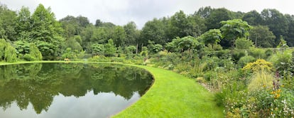 In the Mirror Garden, the sky is reflected in the great sheet of overflowing water.  Around him, the yellow parterre.