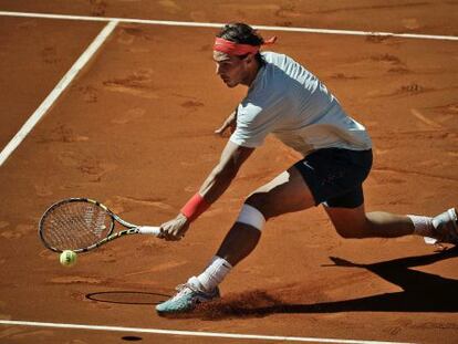 Nadal devuelve una bola ante Andújar.