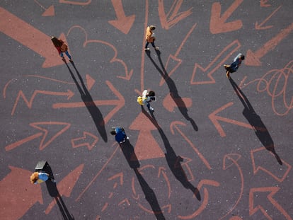 Group of young adults, photographed from above, on various painted tarmac surface, at sunrise.