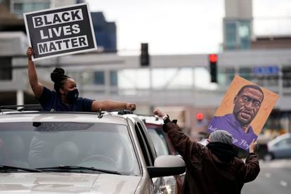 Two people celebrate the conviction against former agent Derek Chauvin, in Minneapolis.