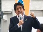 In this image from a video, Japan’s former Prime Minister Shinzo Abe makes a campaign speech in Nara, western Japan shortly before he was shot Friday, July 8, 2022. Abe was shot during the speech and was airlifted to a hospital but he was not breathing and his heart had stopped, officials said. (Kyodo News via AP)