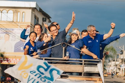 Fernando Villavicencio greets his supporters during a rally.