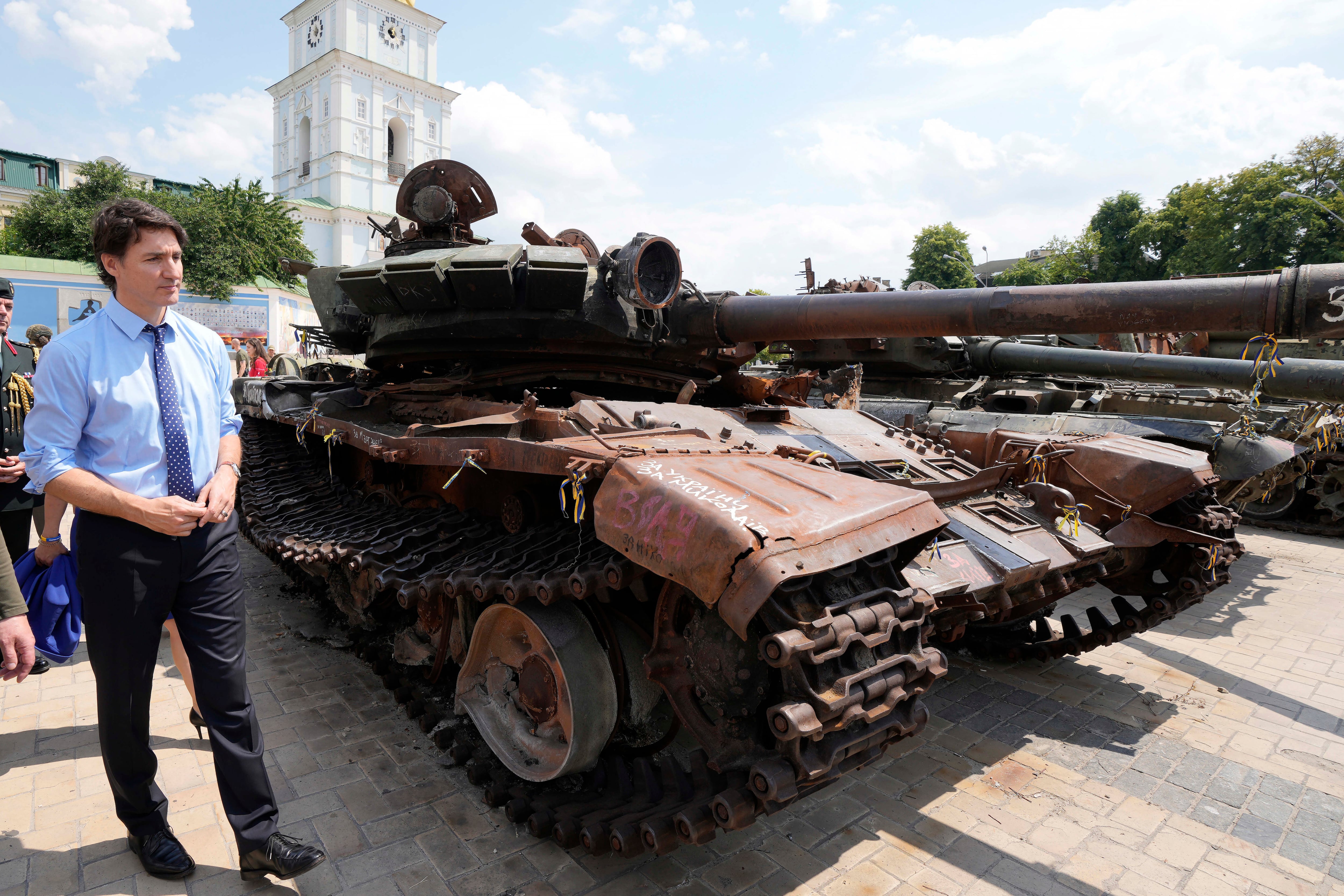 Canadian Prime Minister Justin Trudeau looks at burned out Russian tanks in Kyiv, Ukraine, on Saturday, June 10, 2023.(Frank Gunn/The Canadian Press via AP)