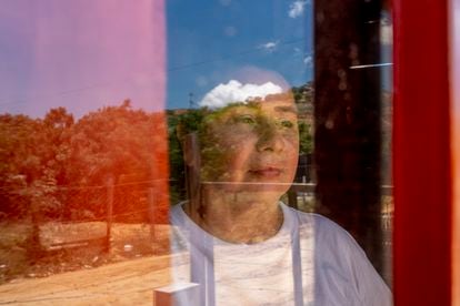Laddy Davina García, 42, at the window of her home.