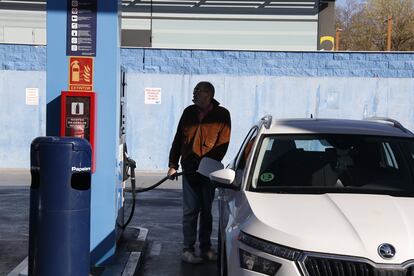 A man refuels at a gas station in Madrid.