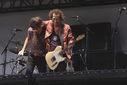 Jagger and Richards embracing in 2005 at a Rolling Stones concert in New York. 