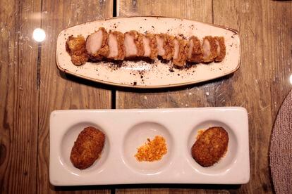 Torreznos y croquetas de cecina con migas del restaurante Ferretería de Madrid.